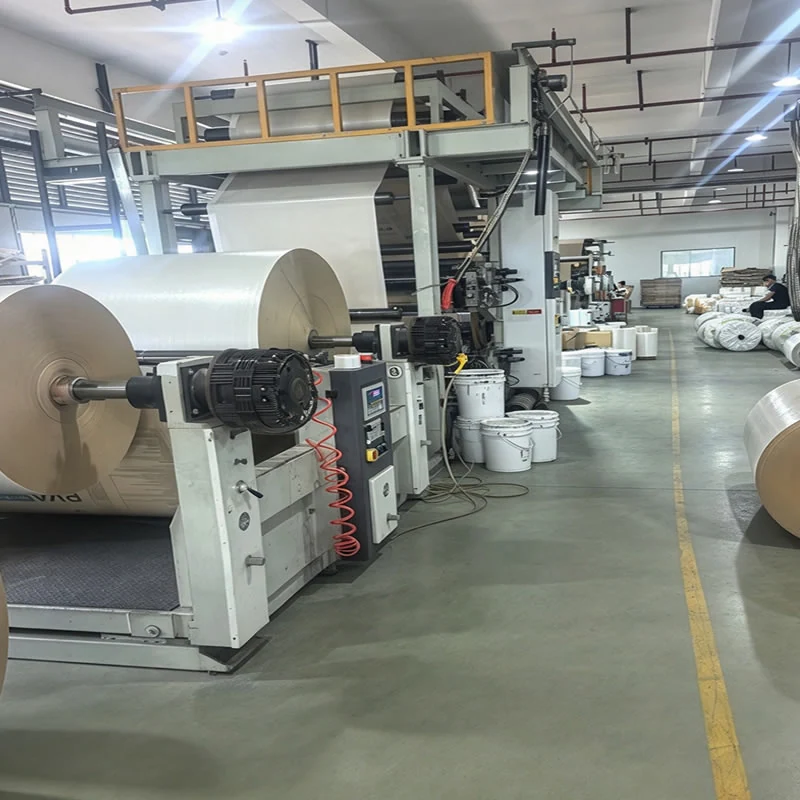 Paper roll unwinder feeding coated kraft paper into the laminating line